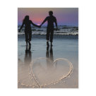 postcard -    An in love couple, holding hands walking barefoot into the beautiful sunset on a sandy beach shore. Written in the sand is a heart. This is a delightfully passionate and romantic scene for lovers, that can be used for numerous special occasions, from Valentine's Day and anniversaries, to "Save the Date" announcements for the bride and groom to be. Also would work perfect for “thank you” after the honeymoon.
