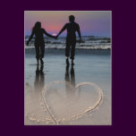 Lovers Holding Hands Walking into the Beach Sunset