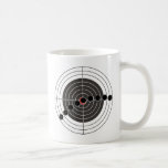 Machine gun bullet holes over target mugs