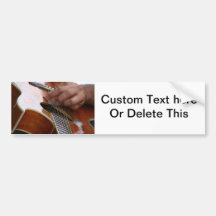 male hand holding pick on acoustic guitar bumper stickers