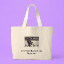 Man and grey on bicycle in England, bags