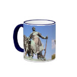 Man and lion statues mugs