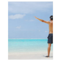 man getting ready to go snorkeling in a tropical i flyers