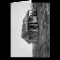 Man in front of the house he built cards