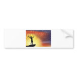 Man on cliff top with arms raised bumper sticker