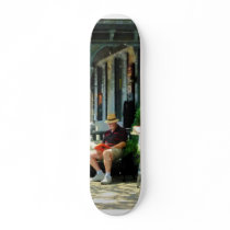 Man Reading by Book Stall Skateboard