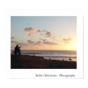 Man with boy feeding gulls at sunset posters