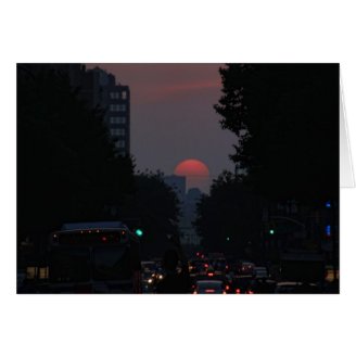 Manhattanhenge: setting pinkish orange sun 5/31/11 greeting card