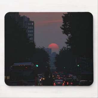 Manhattanhenge: setting pinkish orange sun 5/31/11 mouse pads
