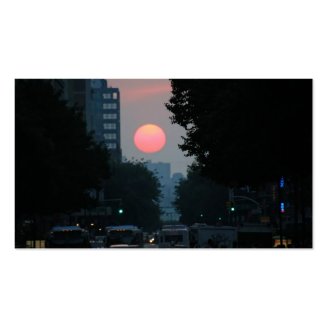 Manhattanhenge: setting pinkish orange sun business card templates