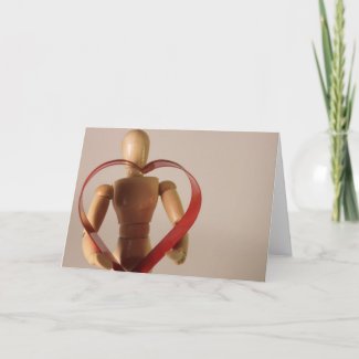 Mannequin holding heart card