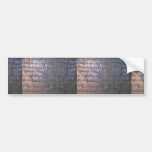 Mantras written in bronze metal bumper stickers
