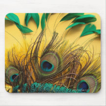 Many different kinds of feathers on a yellow mousepads