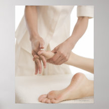 Massage therapist applying foot massage 2 poster