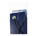 medical stethoscope on blue folder business cards