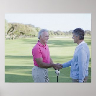 Men shaking hands on golf course poster