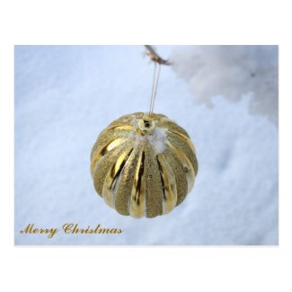 Merry Christmas Golden Ornament In The Snow Postcard