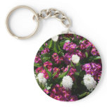 Mixed spring flowers in flower bed keychains
