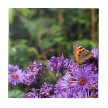 Monarch butterfly and purple flowers ceramic tile