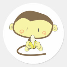Monkey peeling a banana round sticker