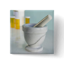 Mortar and pestle, pill bottles in background pinback button