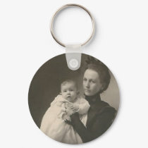 mother holding baby keychains