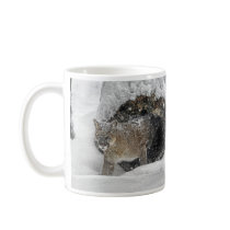 Mountain lion in snow coffee mug