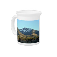 Mountain peaks covered with snow pitcher