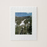 Mountains covered with snow and pine trees puzzles