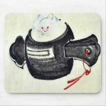 Mouse sitting on a mallet with red ribbon mouse pads