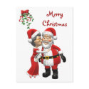 Mrs Claus kissing Santa Postcard