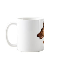 Mug-doberman dog sleeping with teddy bear