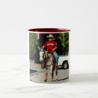 mule being ridden in parade mug