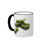multiple green edamame beans with pea pod broken mugs