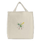 basic_tote_bag - Embroidered Christmas Elf is having a rocking good time at Christmas playing a trumpet and dancing to the music. Blue swirls accent the background.