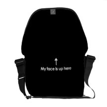 MY FACE IS UP HERE MESSENGER BAGS