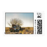 Namibian truck wreck under tree in desert postage