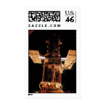 NASA Hubble relfecting a golden sunrise. postage