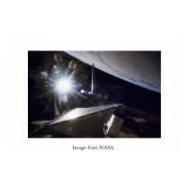 NASA: Shuttle Endeavor sunburst over Earth. posters