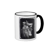 Navaho woman carrying a papoose on her back mugs