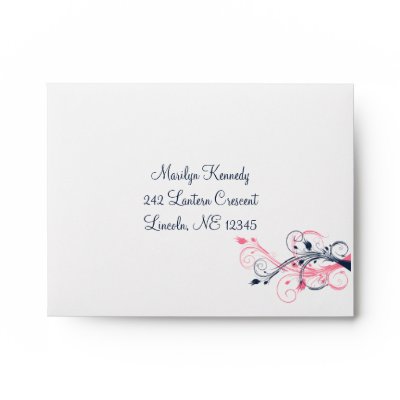 This pink navy blue and white floral A2 envelope matches the wedding