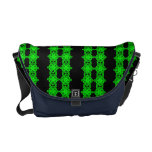 Neon look green pop art flowers over black . messenger bags
