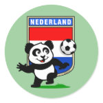 This adorable little panda is too cute! He's featured in front of a large flag from the Netherlands and ready to play football and score some goals. This cute design is perfect for football players and soccer fans.