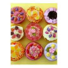 Nine cupcakes each decorated with candy in a post cards
