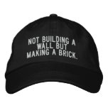 not building a wall but making a brick. embroidered baseball cap