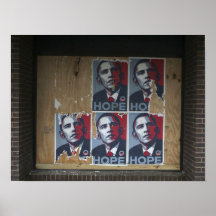 Obama signs in a boarded window of a closed print