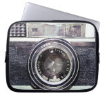 Old black camera computer sleeve