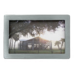 Old ranch building under trees with man statue belt buckle