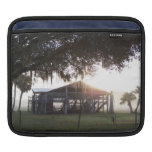 Old ranch building under trees with man statue iPad sleeves