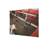 Old table football player stretched canvas prints